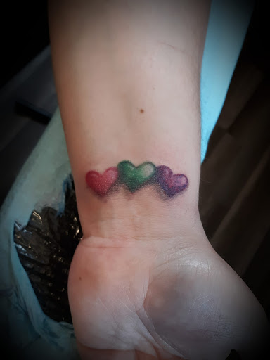 Explore tiny wrist tattoo ideas, creative tattoo ideas in Arcade, available at 98 South Tattoo and Piercing