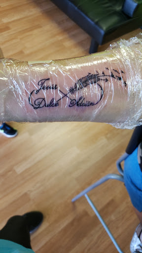 Explore red ink neck tattoo ideas, creative tattoo ideas in Salt Lake City, available at Koi Dragon Tattoos