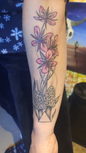 Explore guns and roses tattoo ideas, creative tattoo ideas in Cottage Grove, available at Tattoo Nouvelle