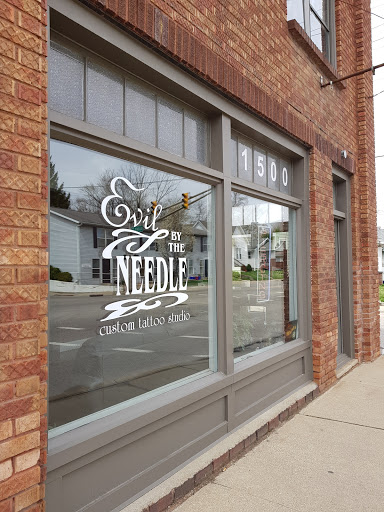 Find harley quinn tattoo ideas for your next unique tattoo in Bloomington at Evil by the Needle Custom Tattoo and Piercing Studio