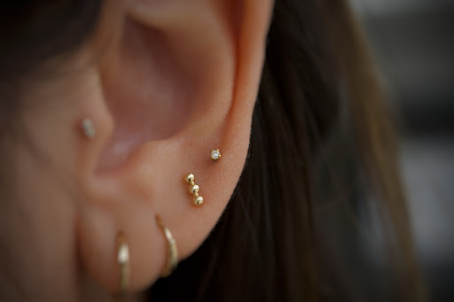 Explore cute flower tattoo ideas, creative tattoo ideas in Corona Del Mar, available at Rainbow Piercing & Jewelry