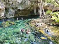 couple at the grand cenote in tulum mexico