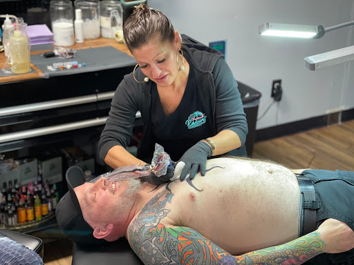 Explore flower of life tattoo ideas, creative tattoo ideas in Whitehall, available at Grumble Bunny Tattoo Company