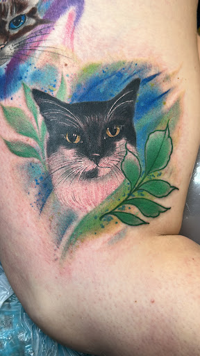 Explore script tattoo ideas for men, creative tattoo ideas in Houston, available at The Neon Jackal Tattoo