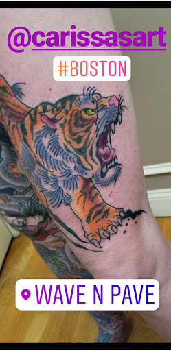 Explore december birth flower tattoo ideas, creative tattoo ideas in East Boston, available at Wave n Pave Tattoo