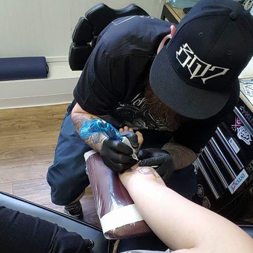 Explore dead dog tattoo ideas, creative tattoo ideas in Sheridan, available at Beard N Lady Tattoo