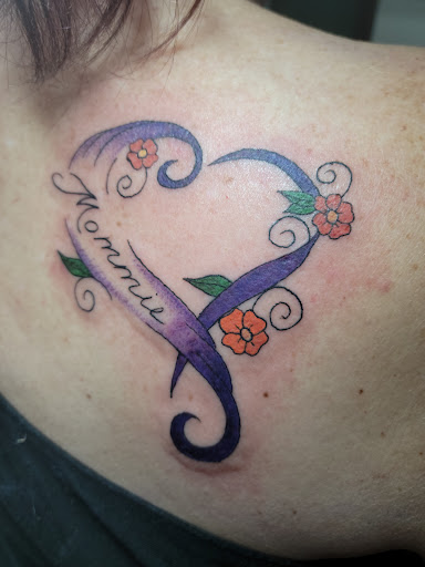 Explore floral tattoo cover up ideas, creative tattoo ideas in San Antonio, available at Twisted Tattoo