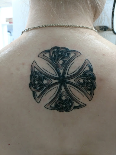 Explore opium tattoo ideas, creative tattoo ideas in Grand Rapids, available at Screaming Needle Tattoo & Body Piercing Studios