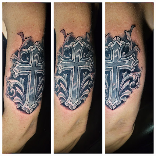 Find spinal cord tattoos ideas for your next unique tattoo in Angola at Hoodlum Ink