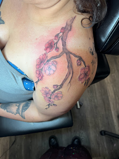 Explore ear tattoo ideas for females, creative tattoo ideas in Meadville, available at Lucky Lucys Tattoo and Art Studio