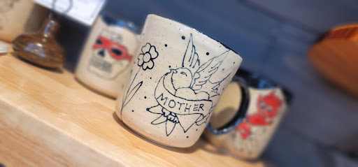 Explore half sleeve flower tattoo ideas, creative tattoo ideas in Lees Summit, available at The Cherry Bomb Tattoo Co.