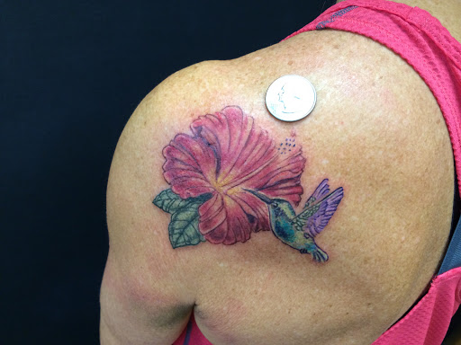 Find tattoo between breast ideas for your next unique tattoo in Ventura at White Lotus Body Arts Studio
