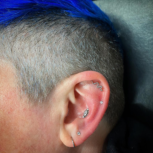 Explore snowboarding tattoo ideas, creative tattoo ideas in Cary, available at Fine Art Body Piercing By Lilith Mae