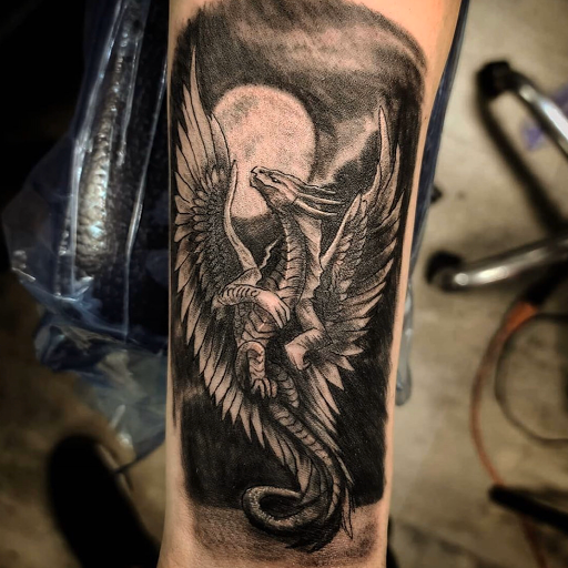 Explore haunted mansion tattoo ideas, creative tattoo ideas in Kenosha, available at Kenosha Tattoo Company