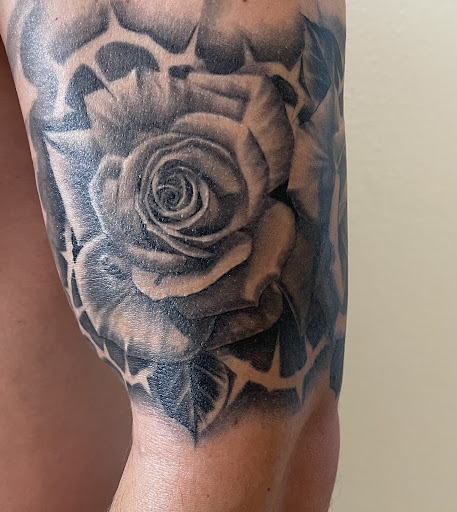 Explore sunflower thigh tattoo ideas, creative tattoo ideas in Denver, available at Ikonik Ink Tattoo