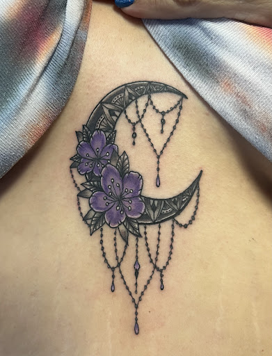 Explore female tattoo sleeve ideas, creative tattoo ideas in Vincennes, available at Silver Owl Tattoo