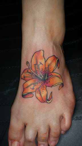 Explore stomach tattoo ideas for guys, creative tattoo ideas in Foley, available at Black Sheep Custom Tattoos and Piercings