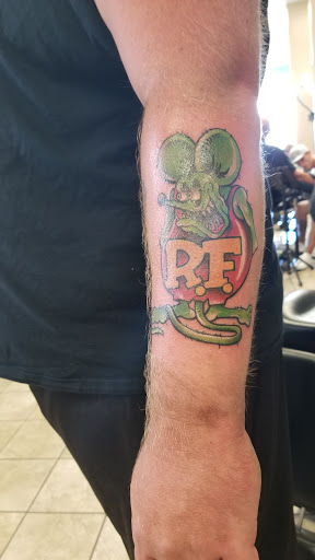 Explore tattoo behind ear ideas, creative tattoo ideas in Baraboo, available at Gold Leaf Tattoo Collective and Art Gallery