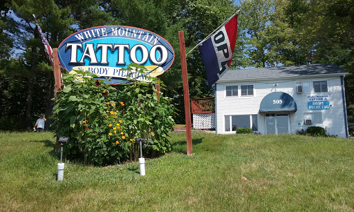 Explore upper arm men tattoo ideas, creative tattoo ideas in Conway, available at White Mountain Tattoo and Body Piercing Studio