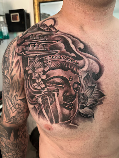 Explore religious elbow tattoo ideas, creative tattoo ideas in Santa Fe, available at Lokote Tattoos