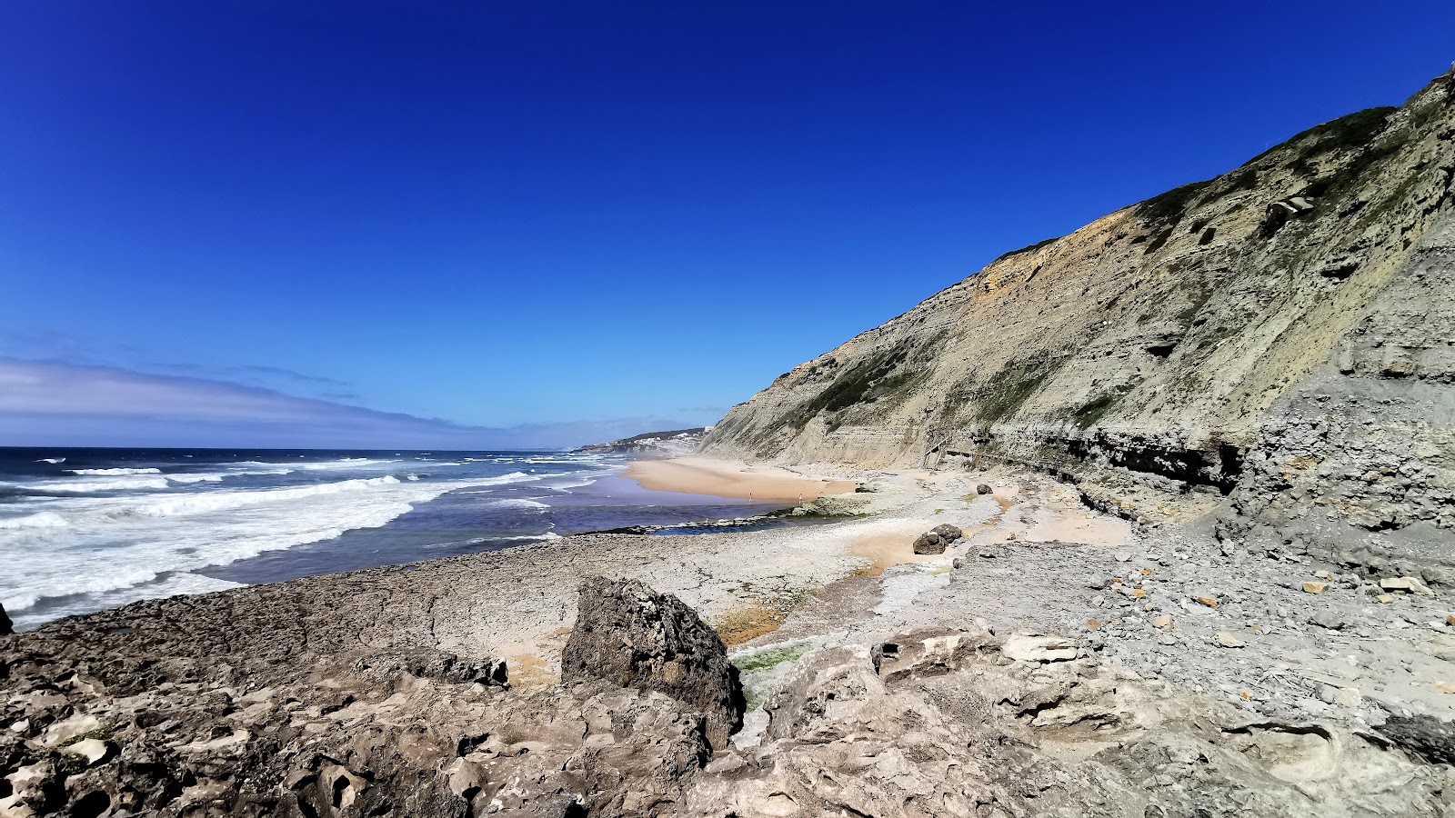 Foto de Praia da Aguda con arena beige superficie