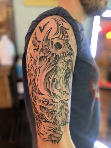 Explore dragon forearm tattoo ideas, creative tattoo ideas in Hayesville, available at Studio 1891 Ink & Art