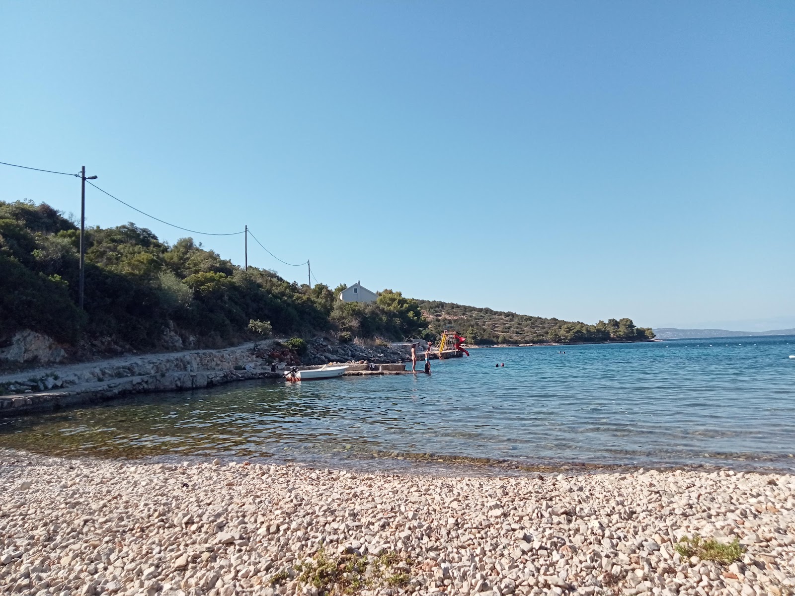 Foto de Zaglav Beach con terreno rocoso superficie