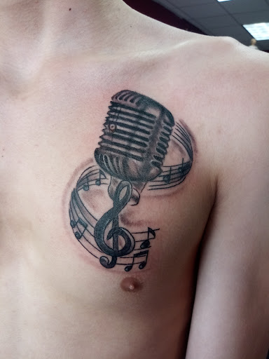 Explore tattoo ideas for men inner bicep, creative tattoo ideas in Buffalo, available at Signature Ink