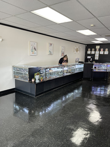 Find chrysanthemum tattoo ideas for your next unique tattoo in Spartanburg at Sticks and Stones Body Piercing