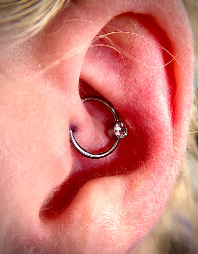 Explore last name tattoo ideas on arm, creative tattoo ideas in Orange, available at Symbiosis Body Piercing