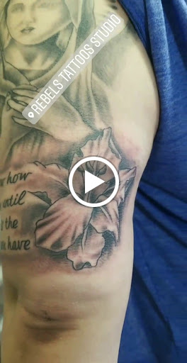 Explore fist tattoo ideas, creative tattoo ideas in Wenatchee, available at Rebels Tattoo Studio