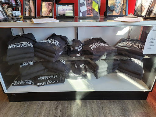 Explore red hand tattoo ideas, creative tattoo ideas in Milford, available at Boston John Tattoos