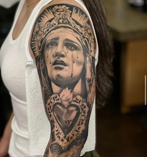 Explore knee tattoo ideas for woman, creative tattoo ideas in Glendale, available at Knucklehead Tattoo Shop