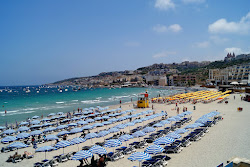 Ghadira Bay'in fotoğrafı geniş bir kıyı şeridi ile birlikte