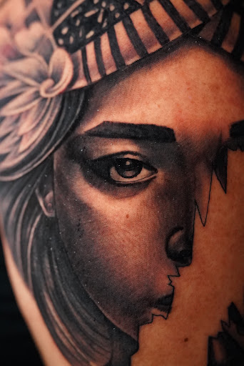 Explore ripped skin tattoo ideas, creative tattoo ideas in Stockbridge, available at Black Rose Tattoo Collective