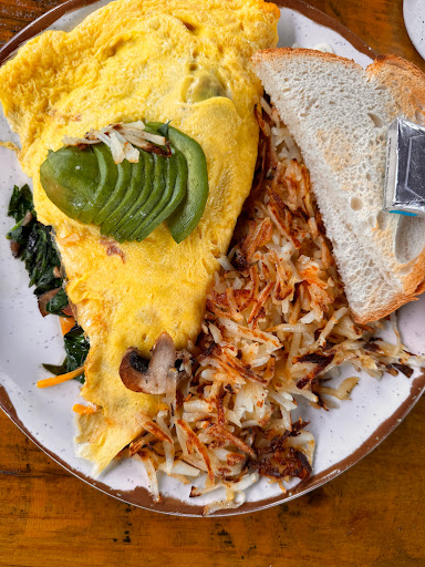 Spinach omelette with hash potatoes