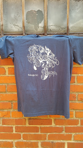 Explore skeleton hand tattoo ideas, creative tattoo ideas in Raleigh, available at Mad Ethels Tattoo & Body Piercing