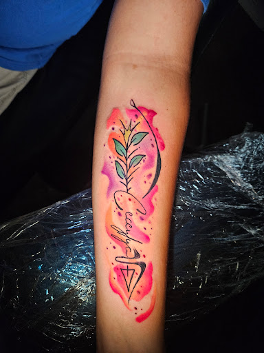 Explore inside ear tattoos ideas, creative tattoo ideas in Angola, available at Hoodlum Ink