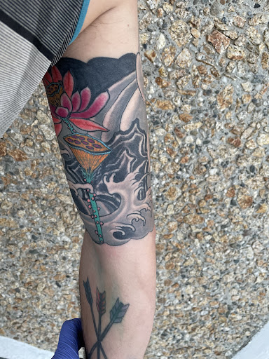 Explore red tattoo ideas women, creative tattoo ideas in Marysville, available at Elegant Arts Tattoo Parlor