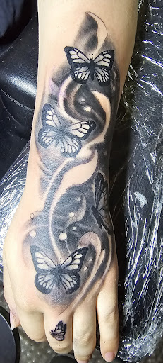 Explore facial tattoo ideas, creative tattoo ideas in Angola, available at Hoodlum Ink