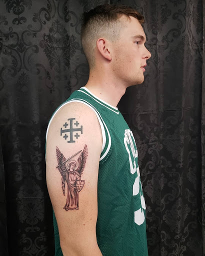 Explore hellscape battle sleeve tattoo ideas, creative tattoo ideas in Mebane, available at The Cardinal Skin Art & Gallery