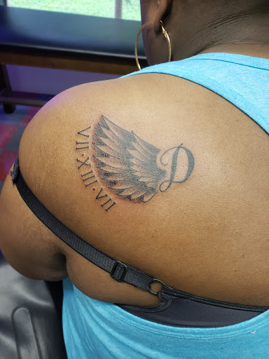 Explore photographer tattoo ideas, creative tattoo ideas in Oxford, available at Opus Land Tattoo co.