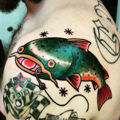 Explore arm cross tattoo ideas, creative tattoo ideas in Pittsburgh, available at Pittsburgh Tattoo Company