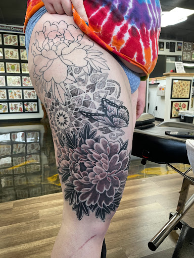 Explore female wonder woman tattoo ideas, creative tattoo ideas in Mount Clemens, available at Hand & Heart Tattoo