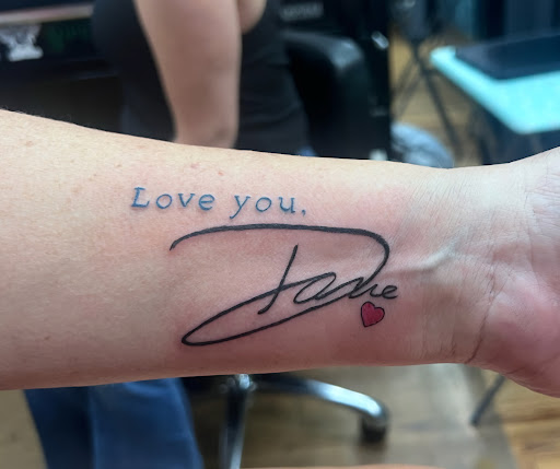 Explore flower tattoo cover up ideas, creative tattoo ideas in Higginsville, available at Painted Lady Tattoo