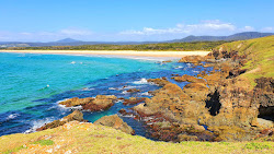 Moonee Beach'in fotoğrafı düz ve uzun ile birlikte