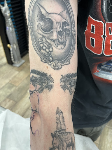 Explore knee cap tattoo ideas for men, creative tattoo ideas in Buford, available at Wild Tribe Tattoos and Piercings