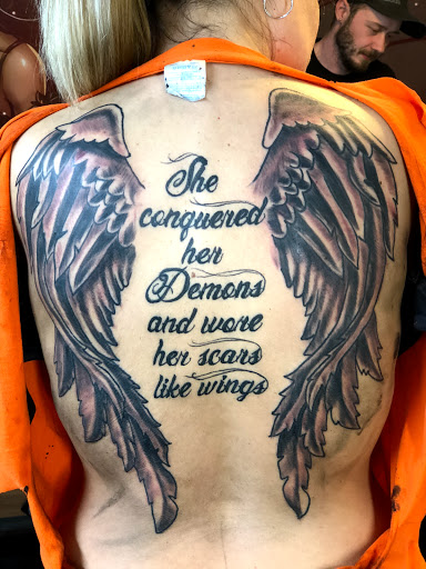 Explore flower spine tattoo ideas, creative tattoo ideas in Portland, available at Art Immortal Tattoo and Piercing