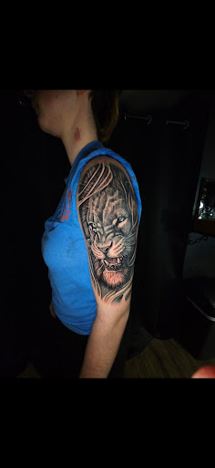 Explore roman numeral tattoo ideas for guys, creative tattoo ideas in Titusville, available at Space Coast Ink Tattoo Studio