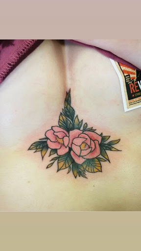 Find tattoo ideas for female chest for your next unique tattoo in Roanoke at Saint Cecilias Art Studio